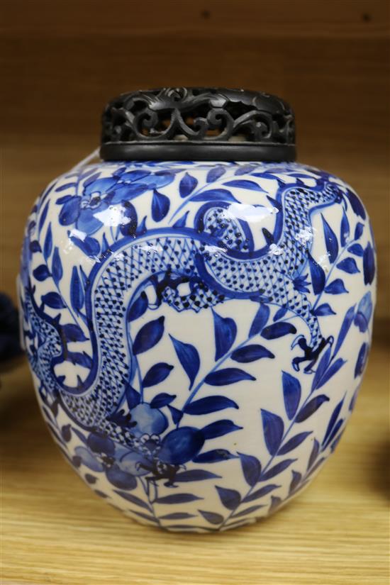 A Chinese blue and white jar, with hardwood cover height 22cm